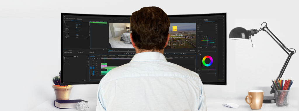 An image of a video editor at his desk editing real estate videos on Premiere Pro.
