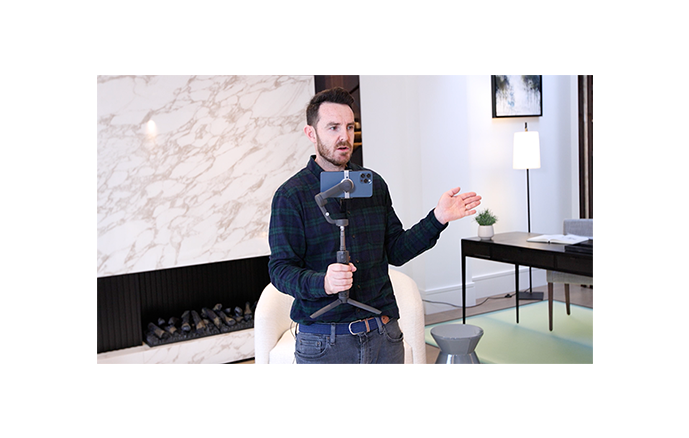 An image of a person training real estate agents how to film real estate videos.